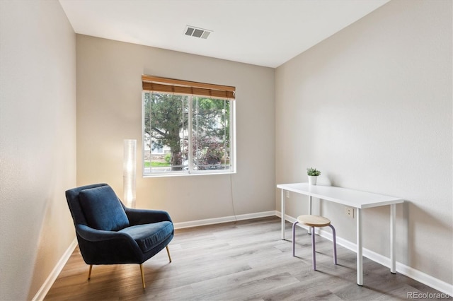 9692 W Coco Cir Unit 103, Littleton, CO 80128 - living area featuring baseboards and wood finished floors