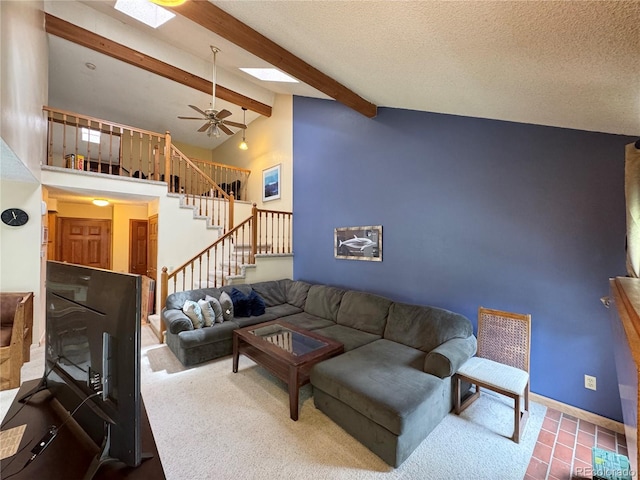 971 S Evanston Cir, Aurora, CO 80012 - living room with stairs, a skylight, beam ceiling, a ceiling fan, and high vaulted ceiling