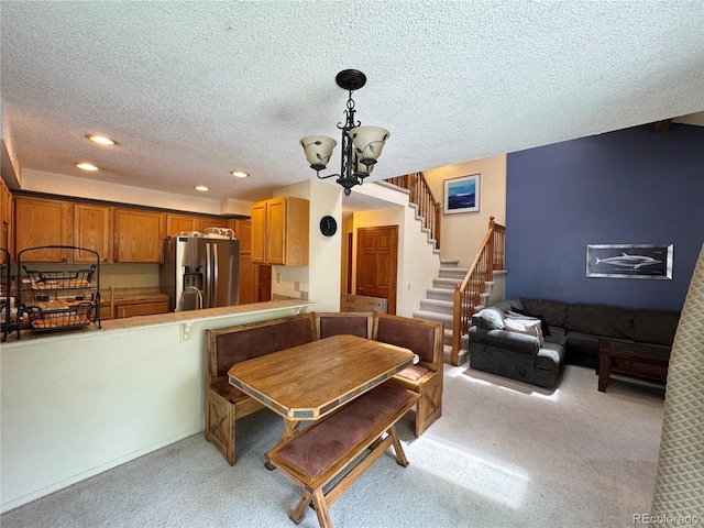 971 S Evanston Cir, Aurora, CO 80012 - dining room featuring light carpet, a textured ceiling, a chandelier, recessed lighting, and stairs