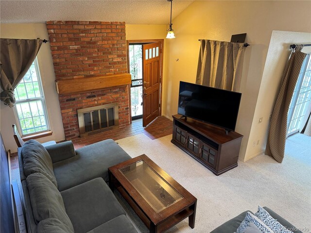 971 S Evanston Cir, Aurora, CO 80012 - carpeted living room with a textured ceiling, vaulted ceiling, and a brick fireplace