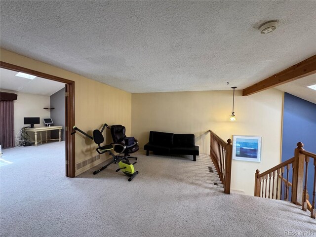 971 S Evanston Cir, Aurora, CO 80012 - living area with an upstairs landing, carpet floors, a desk, and a textured ceiling