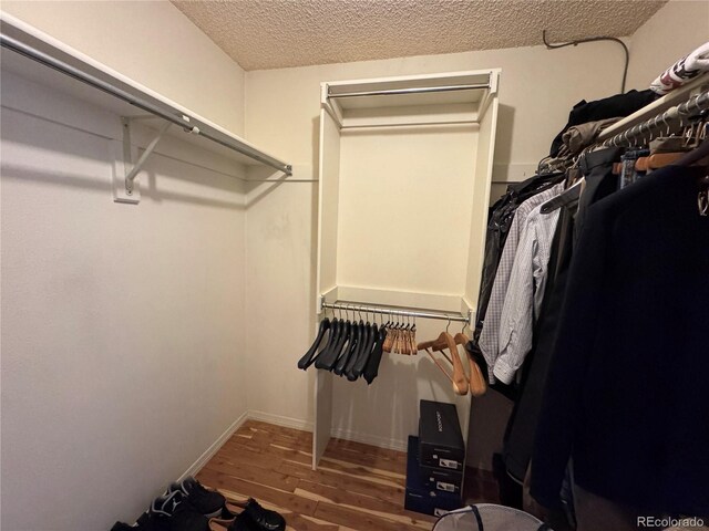 971 S Evanston Cir, Aurora, CO 80012 - spacious closet featuring wood finished floors