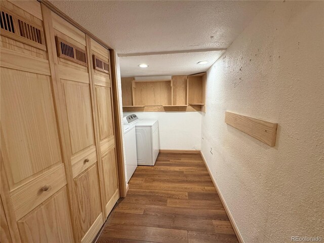 971 S Evanston Cir, Aurora, CO 80012 - hallway with a textured ceiling, independent washer and dryer, a textured wall, dark wood-style floors, and baseboards
