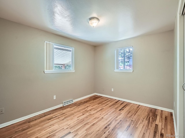 1455 S Zephyr St, Lakewood, CO 80232 - empty room with light wood-style floors and baseboards