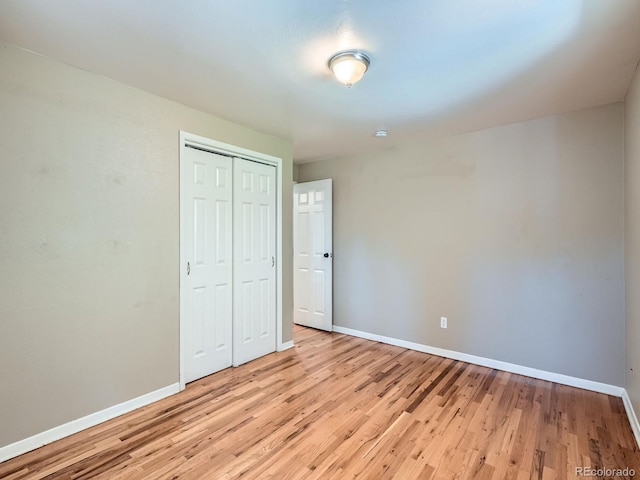 1455 S Zephyr St, Lakewood, CO 80232 - unfurnished bedroom featuring light wood-type flooring and a closet