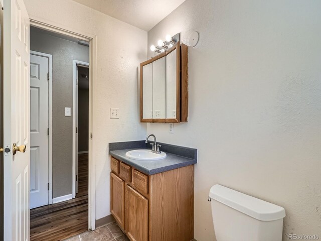 1455 S Zephyr St, Lakewood, CO 80232 - bathroom featuring vanity and a textured wall