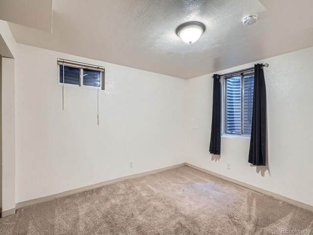 1455 S Zephyr St, Lakewood, CO 80232 - unfurnished room with a smoke detector, carpet floors, and a textured ceiling