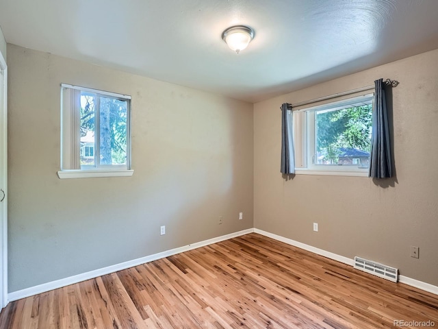 1455 S Zephyr St, Lakewood, CO 80232 - unfurnished room with wood finished floors and baseboards