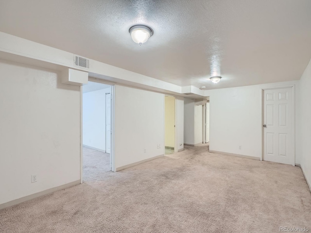 1455 S Zephyr St, Lakewood, CO 80232 - finished below grade area featuring light colored carpet and a textured ceiling