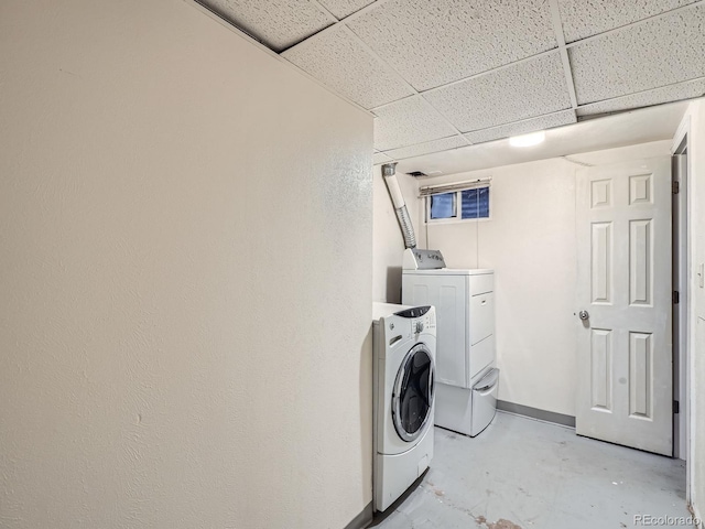 1455 S Zephyr St, Lakewood, CO 80232 - laundry area with washer and dryer and baseboards