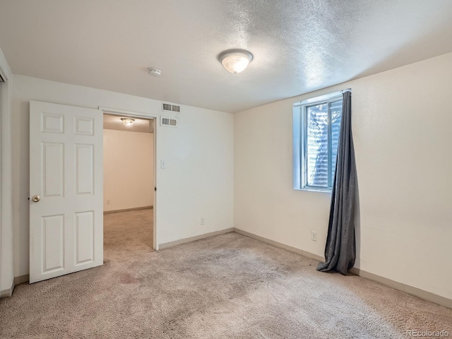 1455 S Zephyr St, Lakewood, CO 80232 - empty room with light colored carpet and a textured ceiling