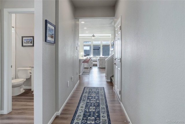 6330 Lythmore Grv, Colorado Springs, CO 80927 - hallway featuring wood finished floors, baseboards, and a textured wall
