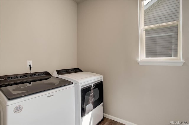 6330 Lythmore Grv, Colorado Springs, CO 80927 - washroom featuring washing machine and clothes dryer, dark wood-style flooring, and baseboards