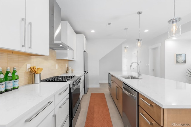 3725 N Franklin St, Denver, CO 80205 - kitchen with a sink, tasteful backsplash, wall chimney exhaust hood, white cabinetry, and appliances with stainless steel finishes