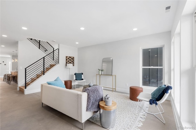 3725 N Franklin St, Denver, CO 80205 - living area with stairs, finished concrete floors, visible vents, recessed lighting, and baseboards