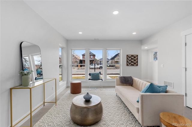 3725 N Franklin St, Denver, CO 80205 - living area featuring baseboards, visible vents, and recessed lighting