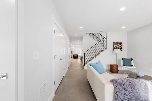 3725 N Franklin St, Denver, CO 80205 - hallway featuring stairs, finished concrete floors, visible vents, recessed lighting, and baseboards