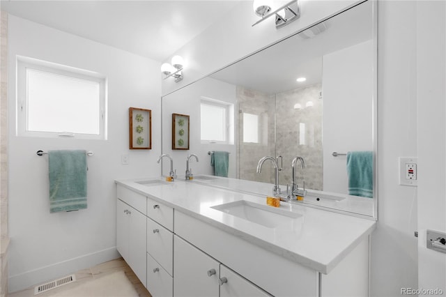 3725 N Franklin St, Denver, CO 80205 - full bathroom featuring visible vents, baseboards, and a sink