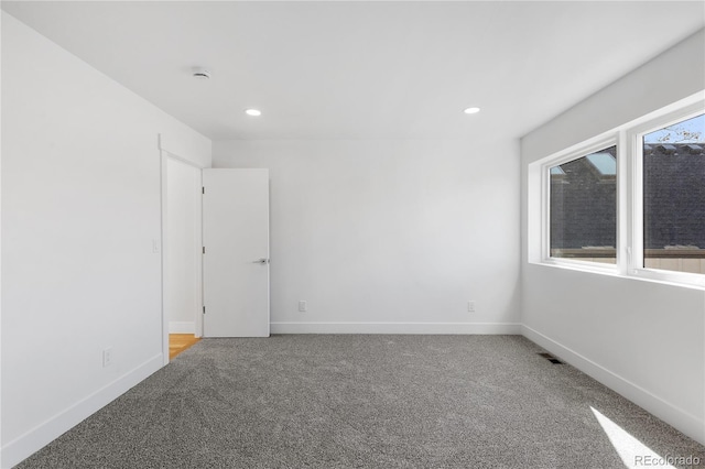 3725 N Franklin St, Denver, CO 80205 - empty room featuring carpet floors, baseboards, and recessed lighting