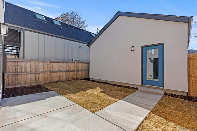 3725 N Franklin St, Denver, CO 80205 - exterior space featuring a patio, roof with shingles, stucco siding, and a fenced backyard