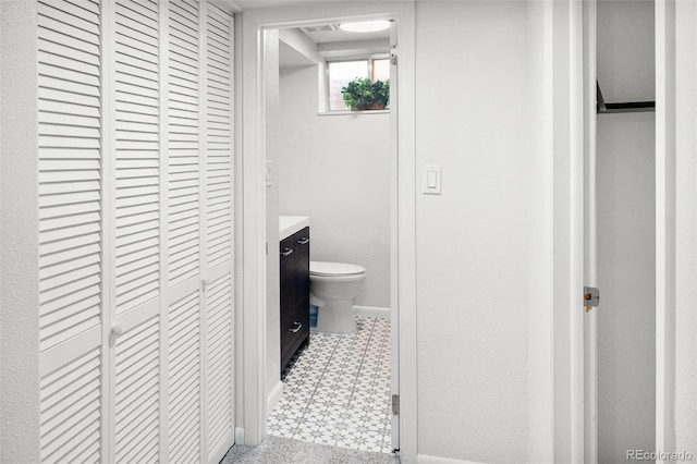 6353 W 78th Ave, Arvada, CO 80003 - bathroom with tile patterned floors, vanity, and a closet