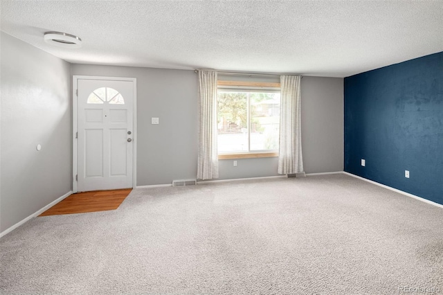 6353 W 78th Ave, Arvada, CO 80003 - carpeted entrance foyer with a textured ceiling and baseboards
