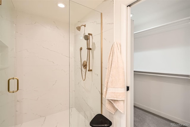 full bathroom featuring recessed lighting and a marble finish shower