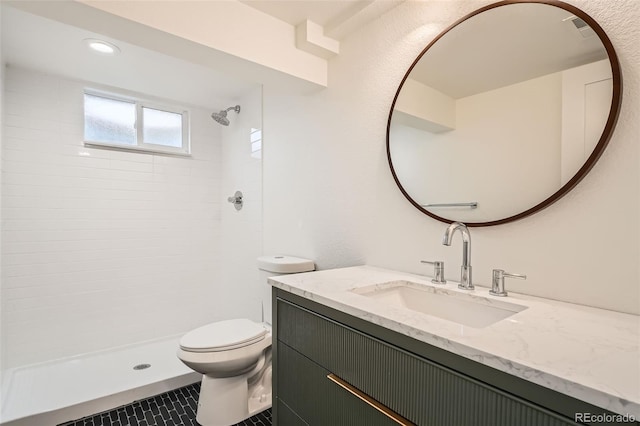 full bath with tile patterned flooring, vanity, toilet, visible vents, and tiled shower