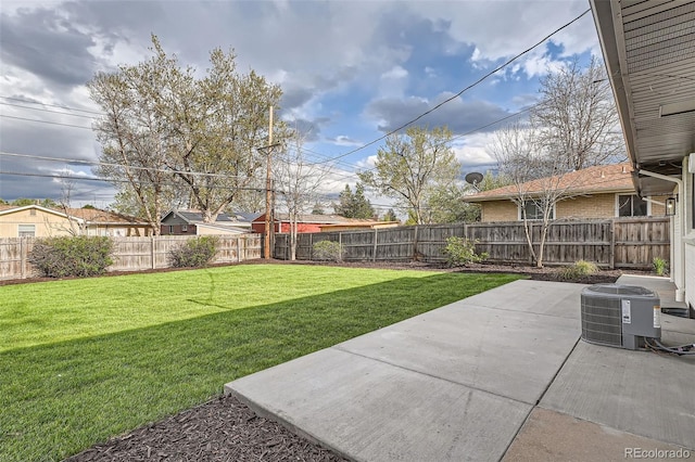 view of yard featuring a fenced backyard, cooling unit, and a patio area