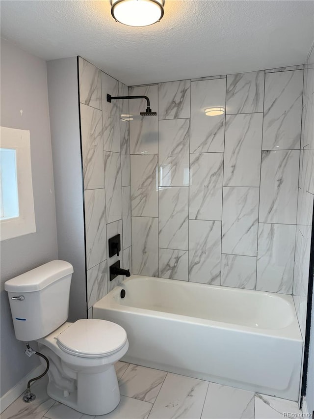 full bathroom featuring a textured ceiling, marble finish floor, shower / washtub combination, and toilet