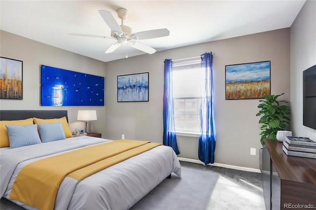 bedroom featuring baseboards, ceiling fan, and carpet floors