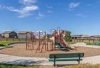 communal playground featuring a residential view