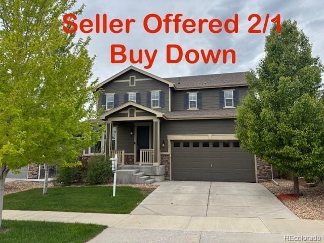 3197 Raintree Ln, Dacono, CO 80514 - view of front of house with a garage, concrete driveway, and a front yard