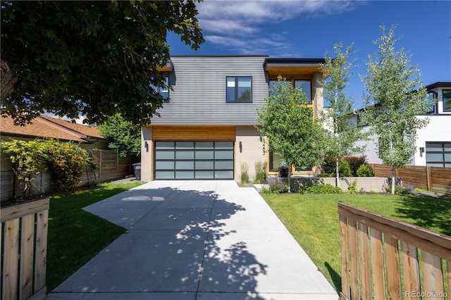 3485 S Clermont St, Denver, CO 80222 - contemporary house with driveway, a garage, and brick siding