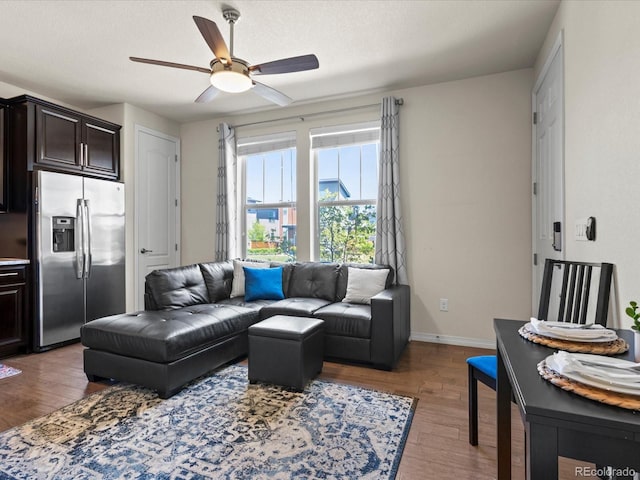 5439 Verbena St, Denver, CO 80238 - living area featuring wood finished floors, a ceiling fan, and baseboards