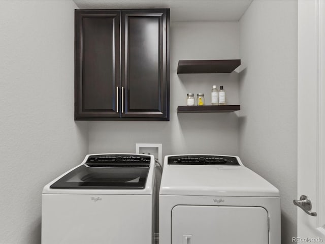 5439 Verbena St, Denver, CO 80238 - washroom featuring washer and dryer and cabinet space