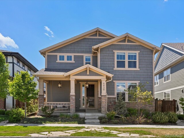 5439 Verbena St, Denver, CO 80238 - craftsman-style house featuring covered porch and stone siding