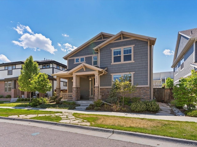 5439 Verbena St, Denver, CO 80238 - view of front of property with stone siding and covered porch