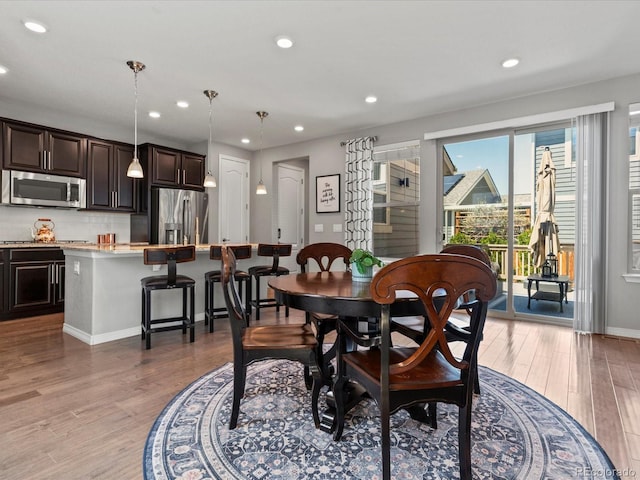 5439 Verbena St, Denver, CO 80238 - dining area with light wood-style floors, recessed lighting, and baseboards