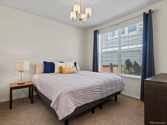5439 Verbena St, Denver, CO 80238 - bedroom with baseboards, a chandelier, and carpet floors