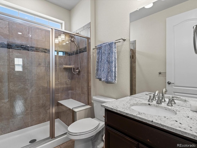 5439 Verbena St, Denver, CO 80238 - full bathroom with toilet, vanity, and a stall shower