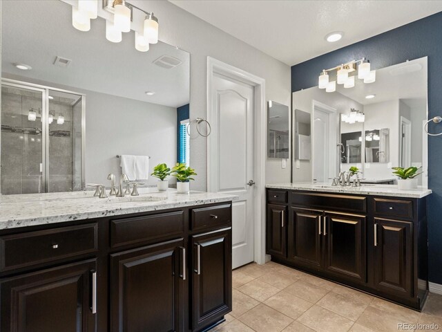 5439 Verbena St, Denver, CO 80238 - full bath with a shower stall, two vanities, and tile patterned floors
