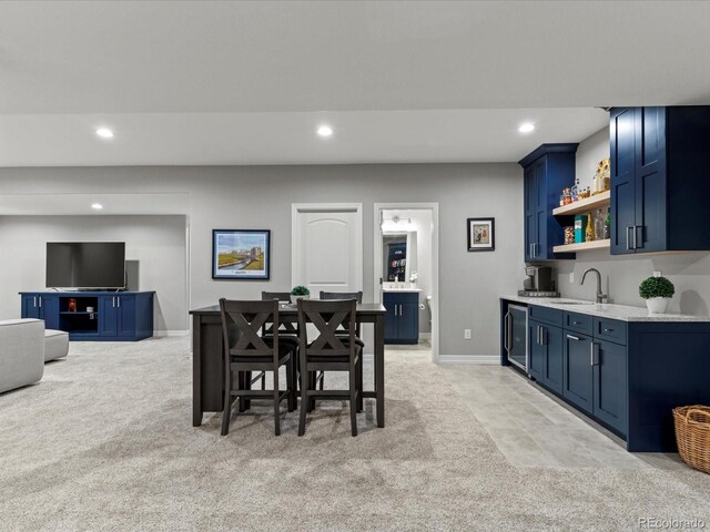 5439 Verbena St, Denver, CO 80238 - dining area featuring light carpet, wet bar, recessed lighting, wine cooler, and baseboards