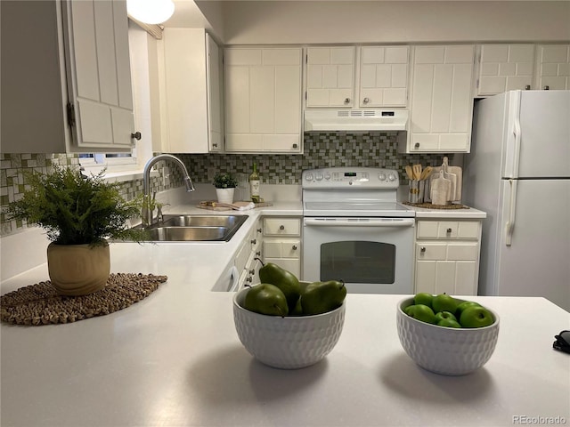 kitchen featuring white cabinetry, sink, white appliances, and decorative backsplash