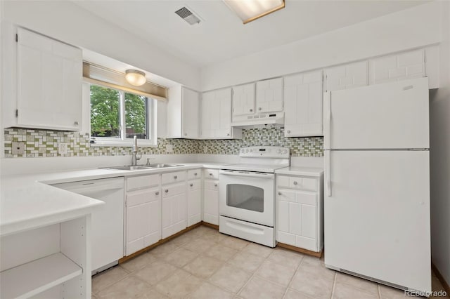 kitchen featuring tasteful backsplash, sink, white appliances, and white cabinets