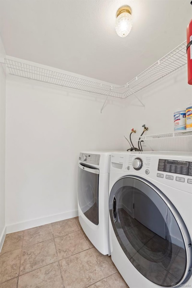 washroom featuring washer and dryer