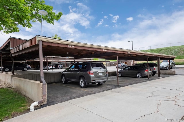 view of vehicle parking featuring a carport