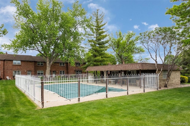 view of pool with a lawn and a patio area