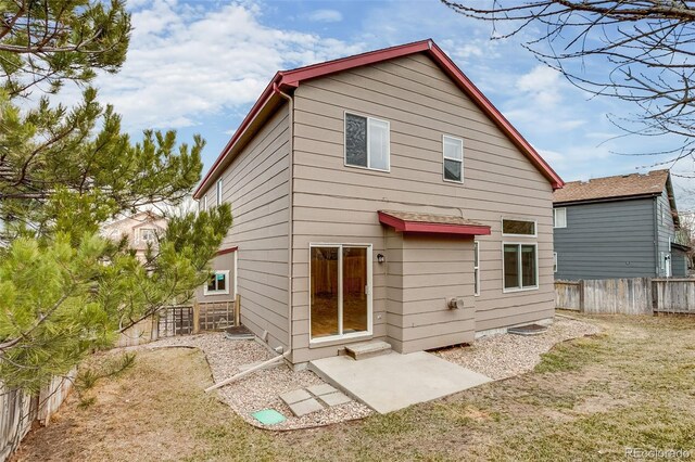 back of house featuring a patio area and fence