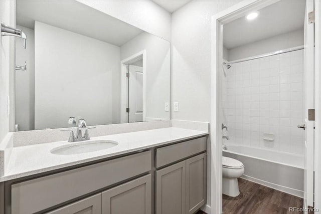 18998 E 94th Pl, Commerce City, CO 80022 - bathroom with vanity, wood finished floors, and shower / tub combination